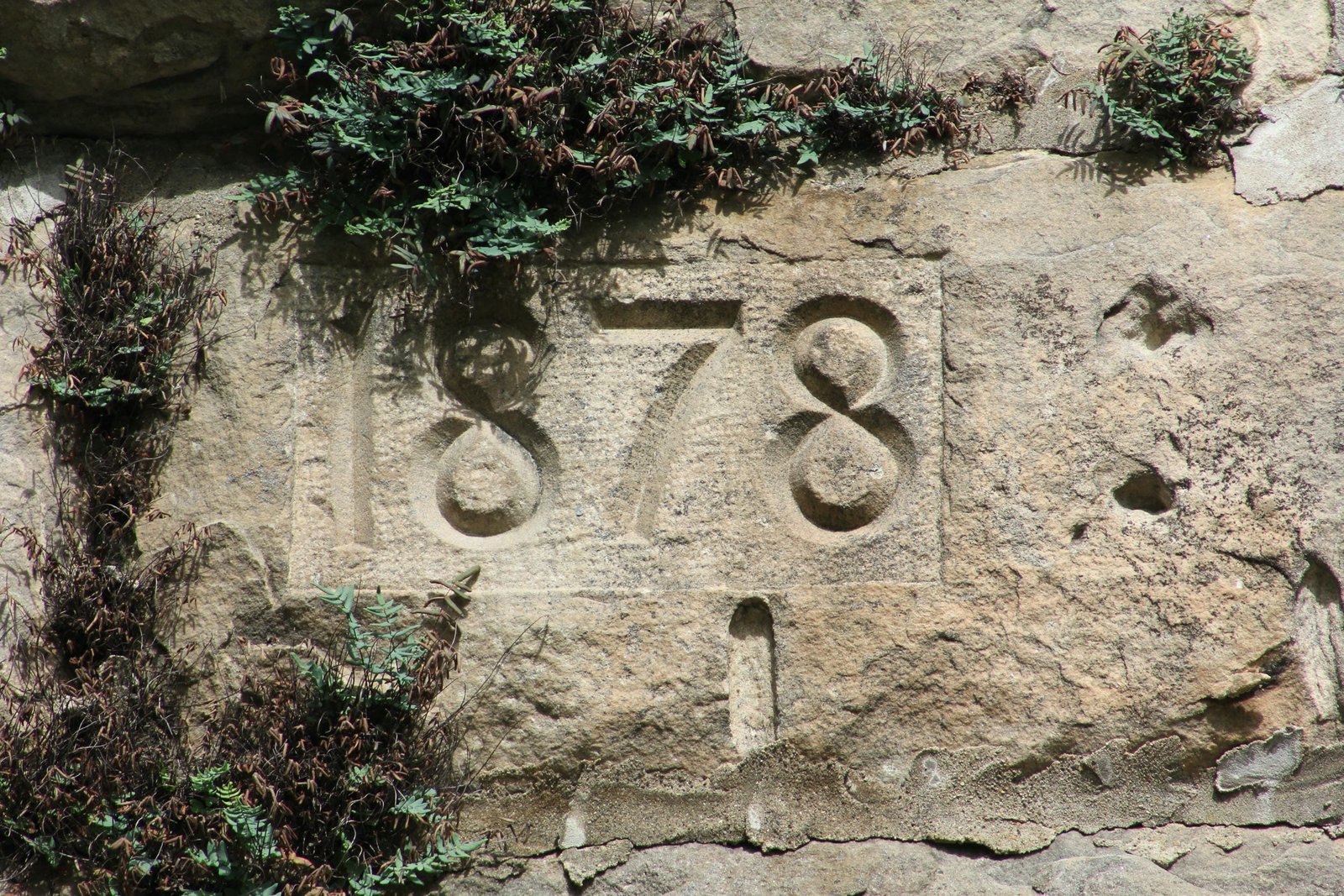 Date stone, west face